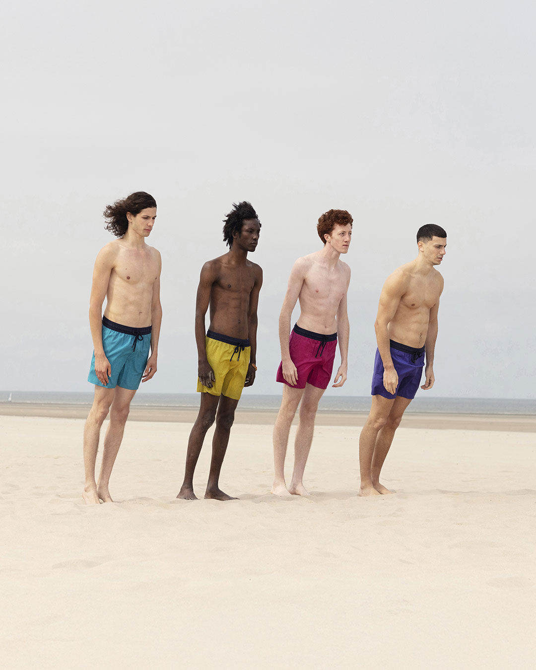 Four men on the beach